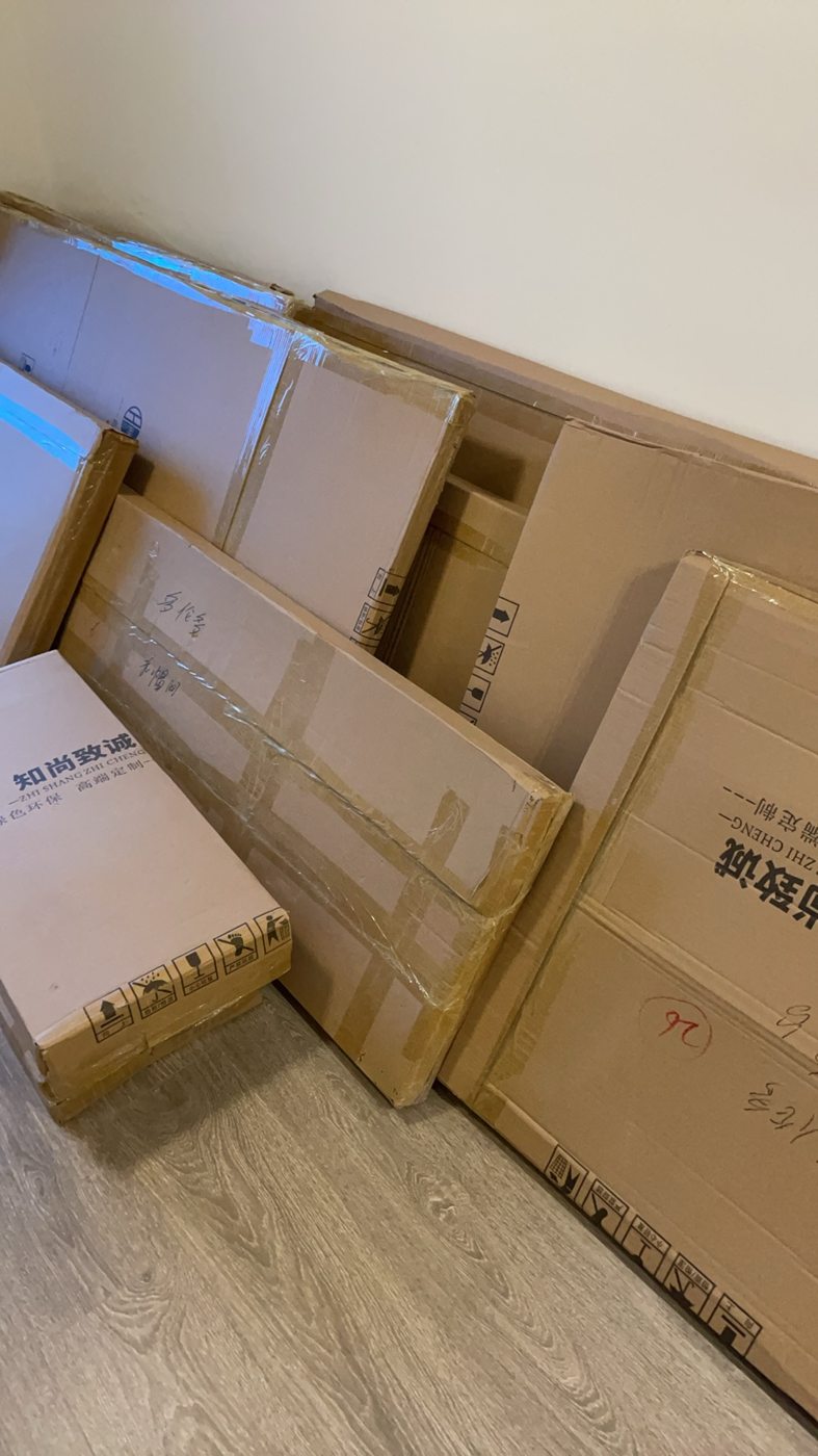 Flat-pack furniture components delivered to a condo