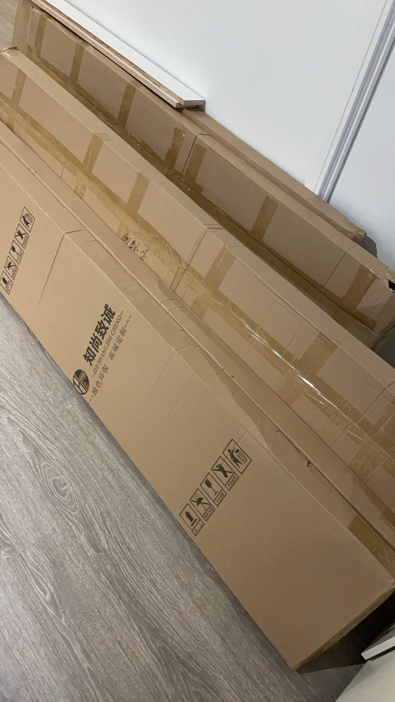 Packed furniture panels staged for assembly